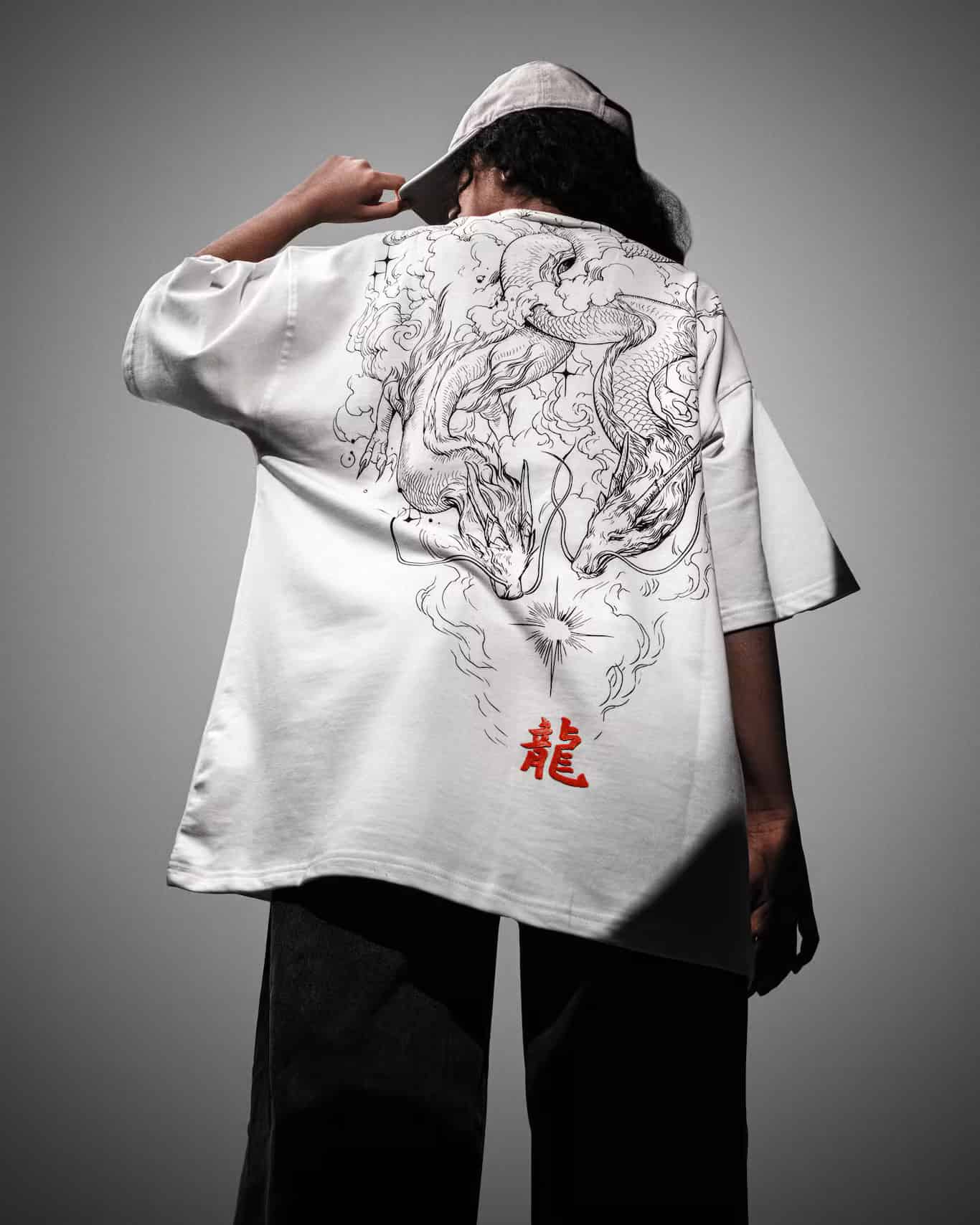 Woman showcasing the back of the Spacered Ryu T-shirt