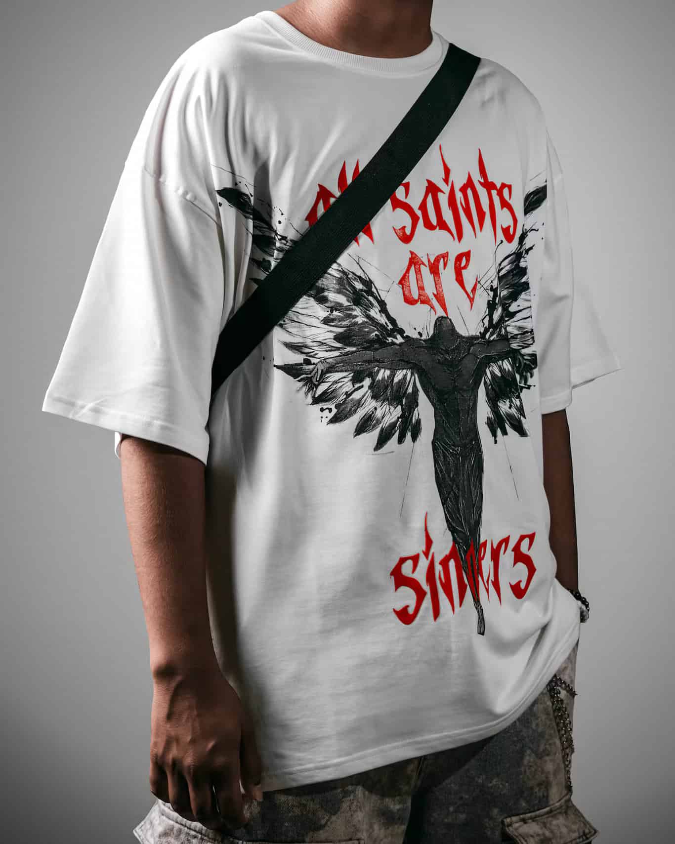 Man showcasing the Spacered Saints T-shirt