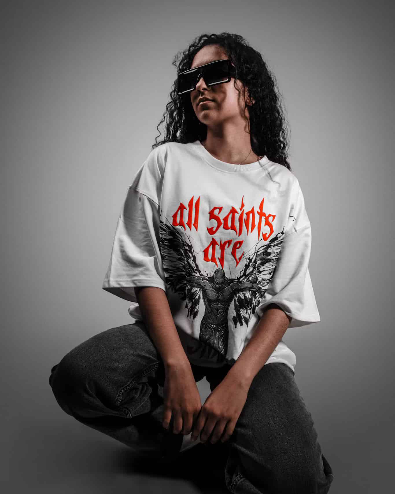 Woman showcasing the Spacered Saints T-shirt