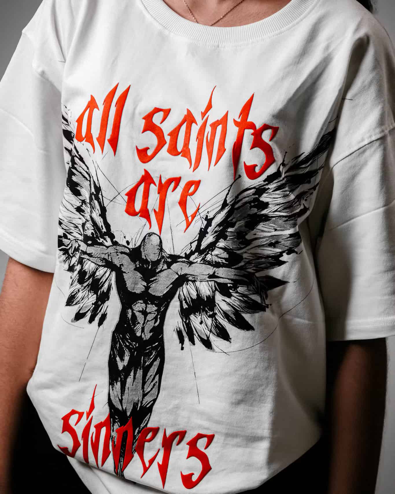Woman showcasing the Spacered Saints T-shirt