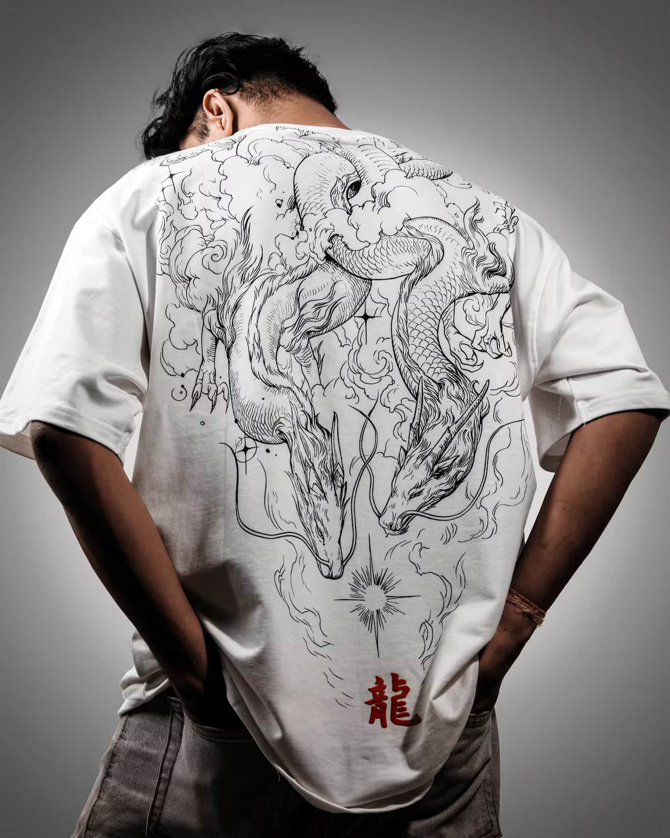 Man showcasing the back of the Spacered Ryu t-shirt